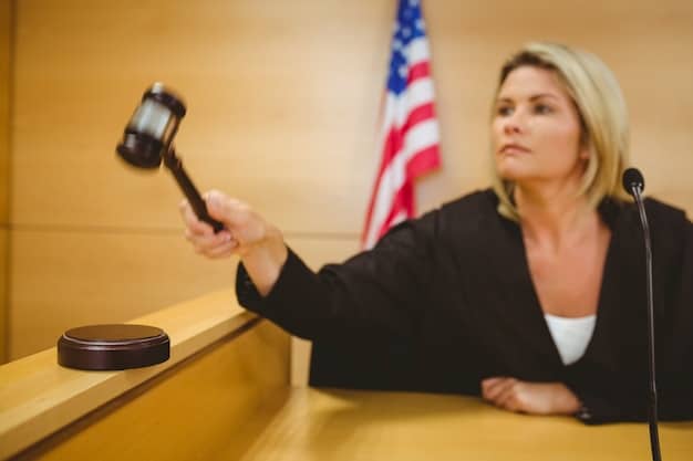A gavel hitting a sounding block in a courtroom setting. The background is blurred, but the focus is on the gavel and the moment of decision.