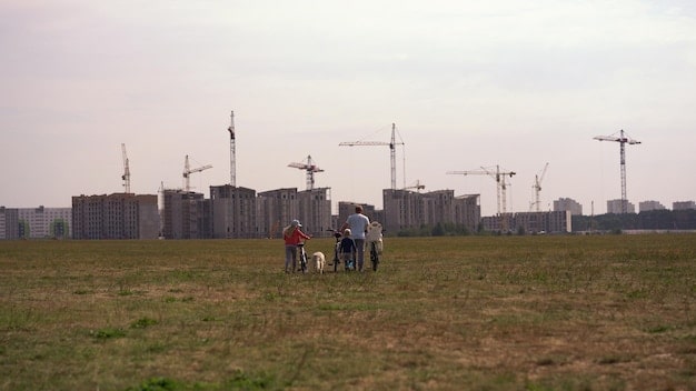A bustling construction site where workers are building a renewable energy facility, showing tangible progress on infrastructure-related policy changes.