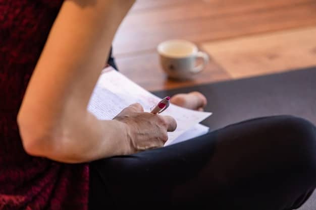 A close-up shot of a person actively taking notes during a town hall meeting. The focus is on their hands writing in a notebook, with a blurred background of other participants listening attentively.