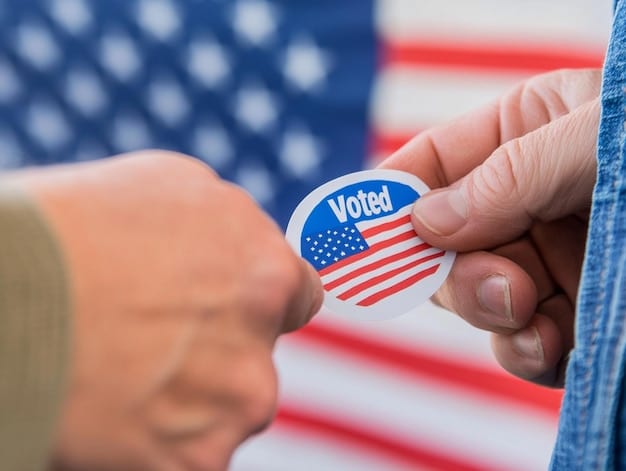 A close-up shot of a person's hand placing a ballot into a voting box at a local election polling station. The 