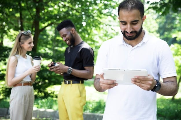 A diverse team of volunteers using laptops and tablets to coordinate tasks at a community event, showcasing the role of technology.