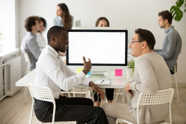 Employees participating in a training session in a modern classroom, with an instructor leading the discussion and interactive displays showcasing the training content.