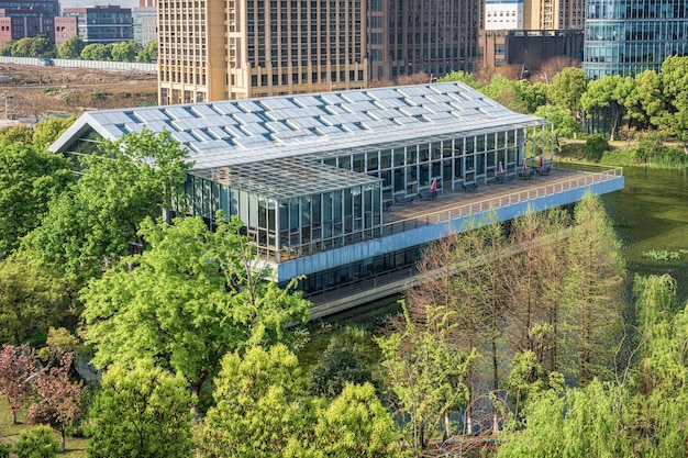An innovative and eco-friendly office building with solar panels and green roofs, representing the growing trend of sustainable and energy-efficient commercial properties.