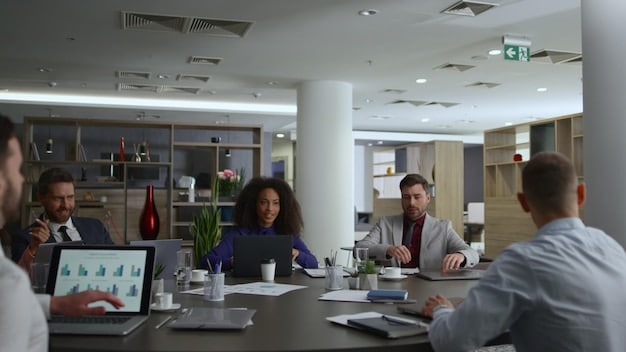 A modern, open-plan office space with entrepreneurs and venture capitalists meeting and discussing business plans. The atmosphere is collaborative and energetic, with large windows overlooking the city.