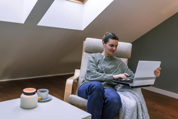 A person working from a home office with a laptop, surrounded by comfortable ergonomic furniture. A cat is resting on the desk, adding a touch of domesticity and highlighting the work-life balance aspect of remote work.