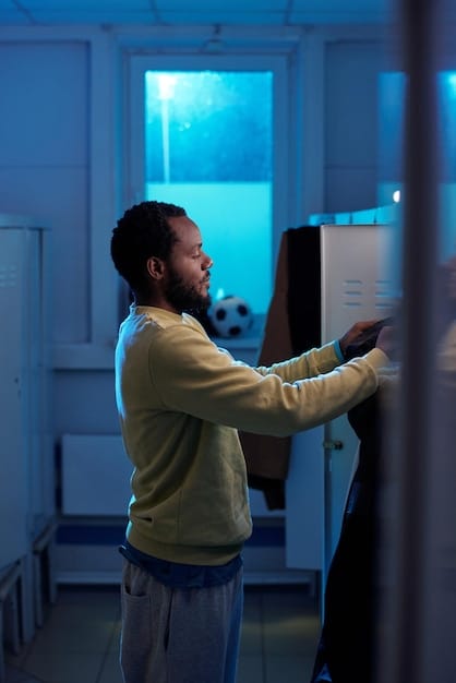 A close-up shot of a cybersecurity expert working on a voting machine, with lines of code displayed on a nearby screen. The expert is focused and determined, symbolizing the dedication to protecting local elections from cyber threats.