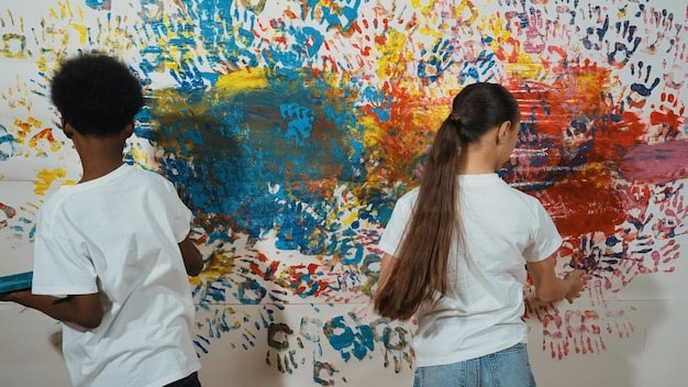 A diverse group of community members engaged in a public art project, painting a mural together. This represents the collaborative and community-focused aspect of events that are eligible for the 'Is Your Community Event Eligible for the Expanded National Endowment for the Arts Grant Program in 2025?', highlighting community involvement.