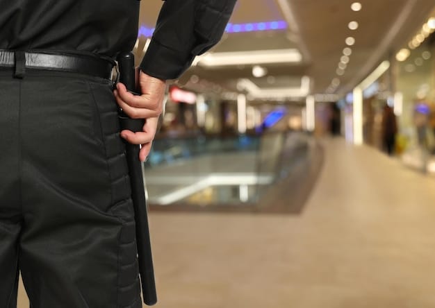 A close-up of a security professional using a handheld metal detector at the entrance of a community event. The focus is on the professional demeanor and the use of technology to enhance security. The background is blurred, showing a line of attendees waiting patiently to enter. This image reinforces the importance of Community Event Security: Understanding the New Federal Guidelines and Best Practices for 2025 through visible and effective security measures.