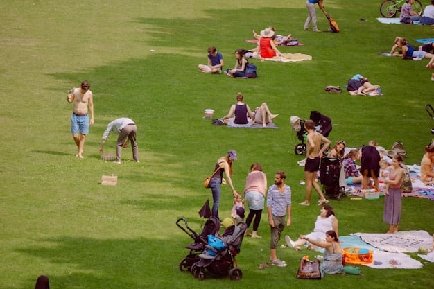A park filled with people, highlighting a well-organized community picnic, with visible signs indicating activity areas and food distribution points, illustrating key aspects of Community Event Planning: A Comprehensive Checklist for Success in 2025.