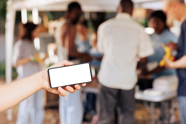 A close-up shot of a mobile phone displaying a donation page for a community event. The screen shows progress towards a fundraising goal, with a prominent 