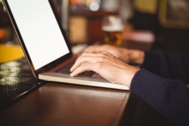 A close-up of hands typing on a laptop, with a screen displaying a local government website page about event permits, indicating the importance of online research. Navigating the Permit Process for Community Events: A State-by-State Guide for 2025 is critical.