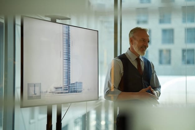 A corporate executive demonstrating an energy-efficient building management system on a touch screen in a modern office.