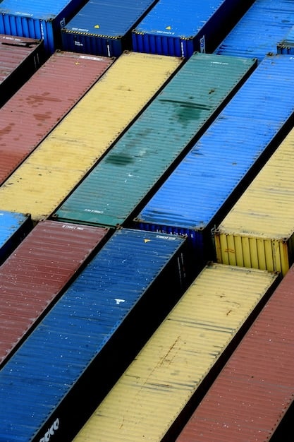 A close-up shot of shipping containers stacked at a port, symbolizing the ongoing supply chain disruptions affecting small businesses and contributing to the surge in bankruptcy filings. The image conveys the challenges of sourcing goods and materials in the current economic climate.