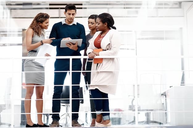 An image showcasing a diverse group of international business professionals collaborating in a modern, glass-walled conference room, located in a high-tech facility. The team is reviewing charts and data projections on a large screen illustrating global trade flows and potential tariff impacts. The setting suggests strategic planning to mitigate the impact of Updated: The Latest on the US-China Trade Negotiations and Potential Tariffs Impacting Businesses.