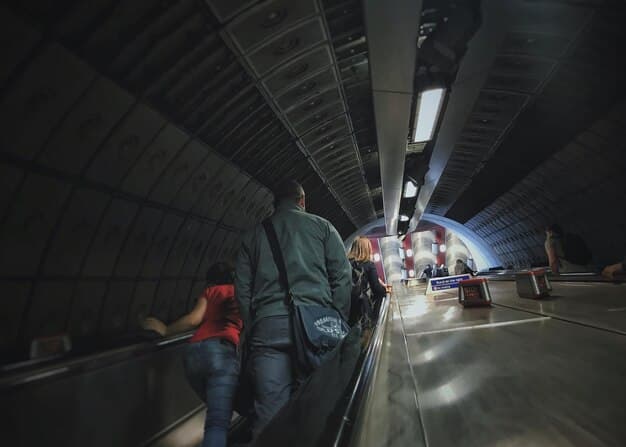 A close-up view of construction workers collaborating on a new section of subway tunnel. The scene should depict a busy, well-organized work environment with modern equipment and safety protocols in place, highlighting advancements in urban infrastructure projects driven by The Impact of the Infrastructure Bill on the Construction Industry: New Projects and Opportunities.