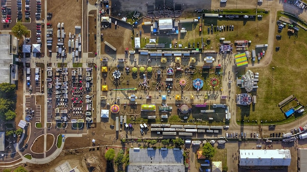 An aerial view of a rural American town, showcasing various community facilities like schools, hospitals, and public parks that benefit from Government Grants.